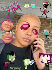 a girl is talking on a cell phone with some cartoon characters on her face