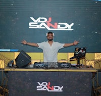 a man standing in front of a dj booth