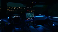 the interior of a vehicle is lit up at night