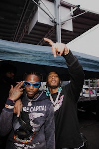 two men in sunglasses posing for a picture