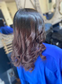 the back of a woman's hair in a salon