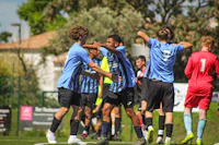 a group of soccer players on a field