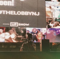 a large screen with the word 'the lobbyn j' on it