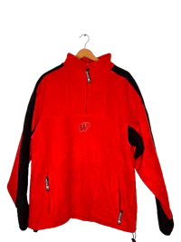 a red and black fleece jacket hanging on a hanger