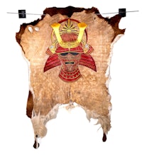 a piece of leather with a samurai head on it