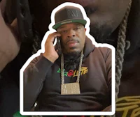 a man in a hat talking on a cell phone