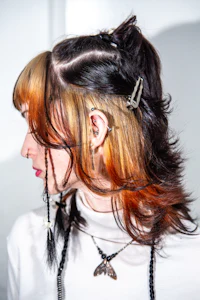 a woman with orange and black hair