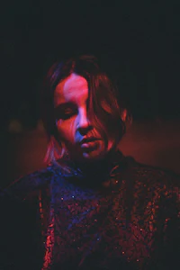 an image of a woman in a dark room