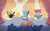 a group of cartoon animals on stage with confetti