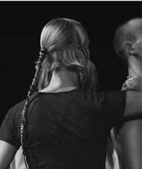 a black and white photo of a man and a woman