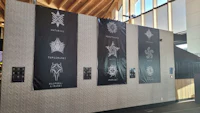 a group of banners on the wall of a building