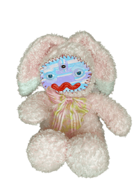 a pink stuffed bunny with a pink bow on it