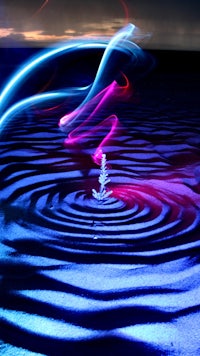 a light painting of a wave in the water