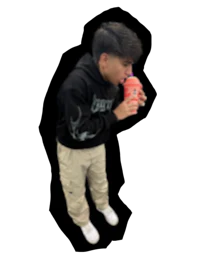 a young man drinking a drink from a cup
