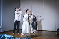 a group of people dancing in a room