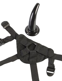 a black harness with a horn attached to it