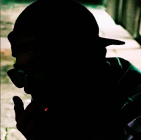 a man is smoking a cigarette