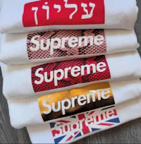 four t - shirts with the word supreme on them