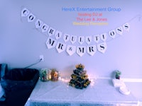 a table with a banner that says congratulations to mrs and mrs