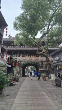 a street in an old chinese town with a bridge