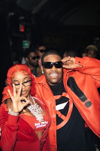 a man and woman posing for a picture at a party