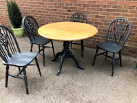 a table with four chairs and a wooden table