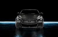 the front end of a black infiniti suv in a dark room