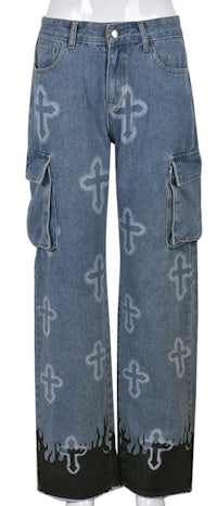 a pair of denim cargo shorts with crosses on them