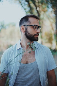 a man wearing glasses and a shirt