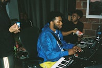 a group of people sitting around a keyboard