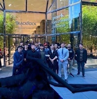 a group of people standing in front of a building
