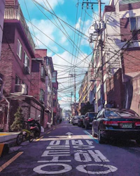 a street in seoul with cars parked on it