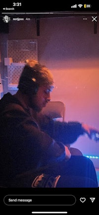 a man is playing a game on his phone