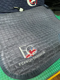 a blue saddle pad with the british flag on it