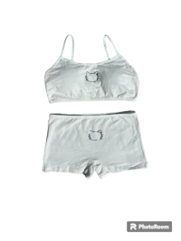 a white bra and underwear set on a black background