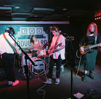 a group of people playing music in a room