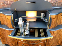 a bar cabinet with a drink in it