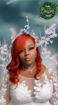 a woman with red hair in a white dress