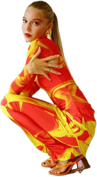 a woman crouching down in a red and yellow jumpsuit