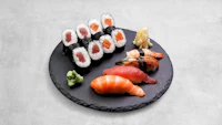 japanese sushi on a black plate