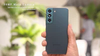 the samsung galaxy a20 is being held up by a person