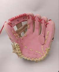a pink baseball glove on a white background