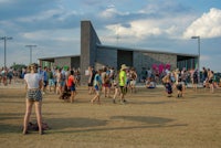 a crowd of people standing in front of a building