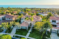 an aerial view of a home near the ocean