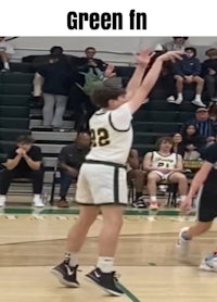 a basketball player is trying to block a shot