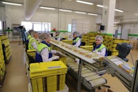 a group of people working in a factory