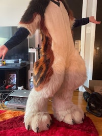 a person dressed as a wolf in a living room
