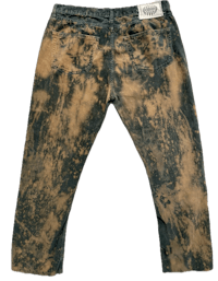 a pair of jeans with a brown stain on them