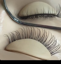 a pair of false eyelashes in a mirror