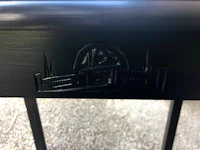a black table with a logo on it